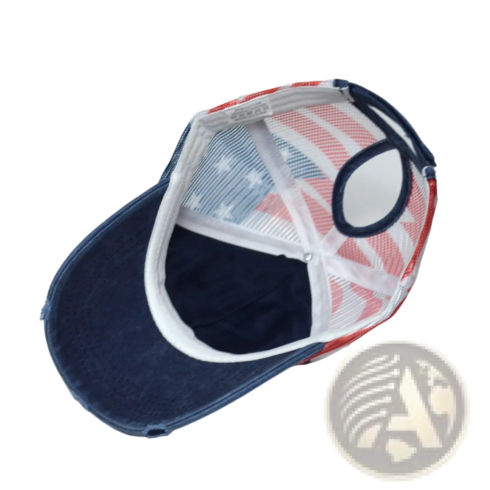 A navy blue denim trucker hat with a red white and blue mesh back panel featuring an American flag design