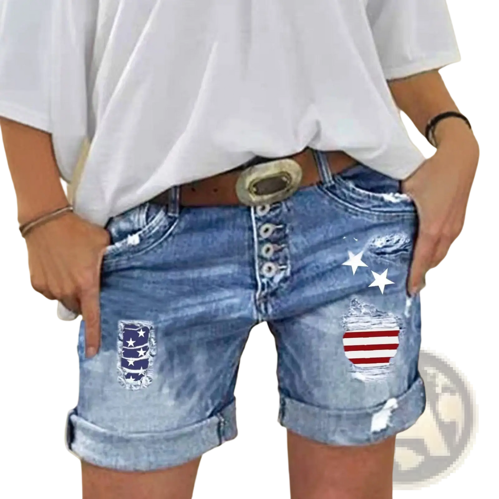 American flag ripped denim shorts in blue with distressed patches and a button fly design