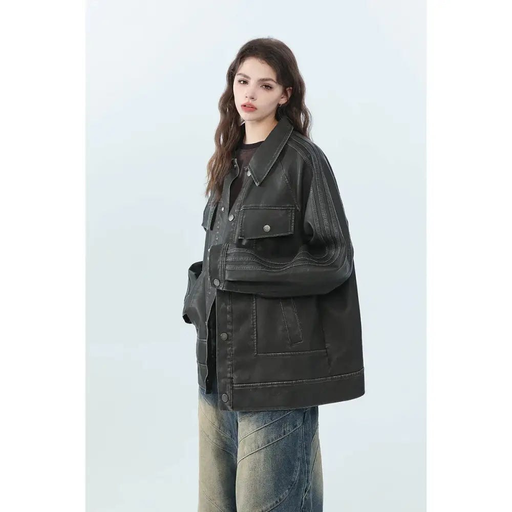 Black retro distressed unisex PU leather biker jacket with stitched detailing and multiple pockets displayed from front