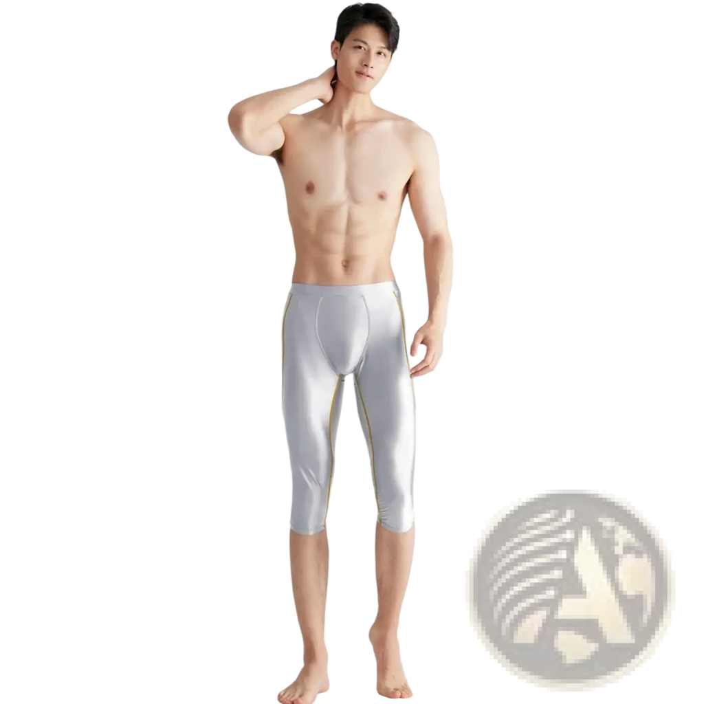 Amoresy men shiny compression swim trunks in silver with gold trim featuring form-fitting capri length design