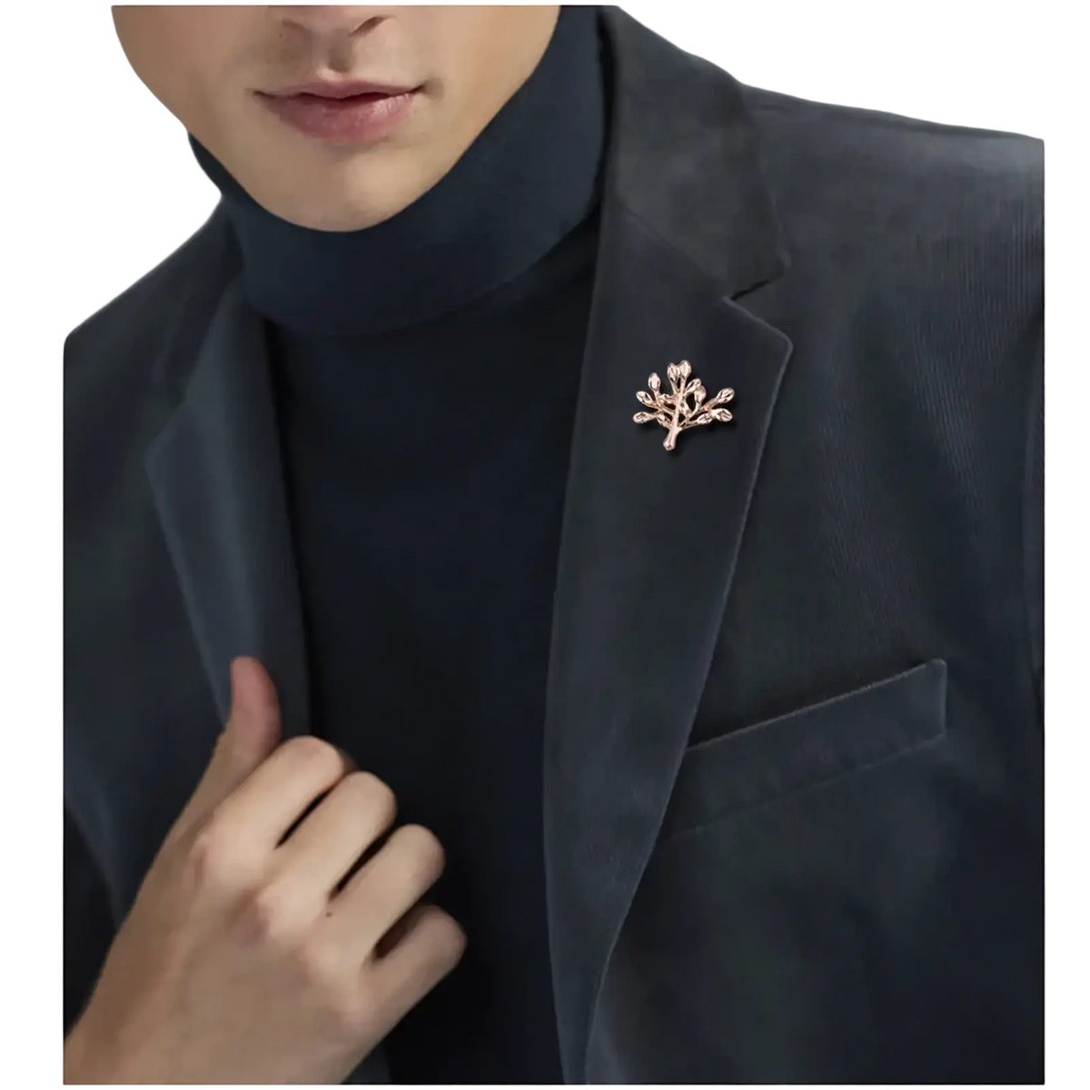 Delicate rose gold metal tree-shaped anchor lapel pin with sparkling stones pinned to dark velvet men’s blazer