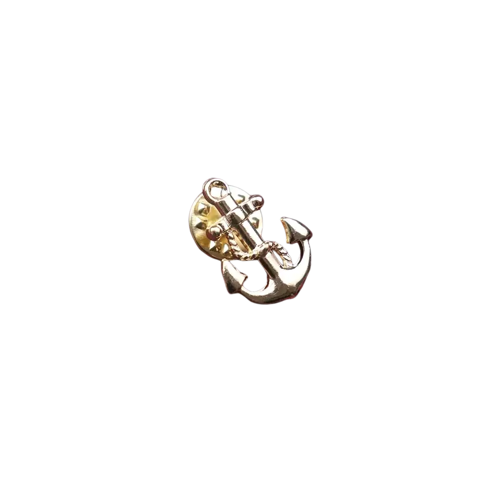 Gold-toned metal anchor lapel pin for men resting on textured maroon knitted fabric ideal for suits and brooches