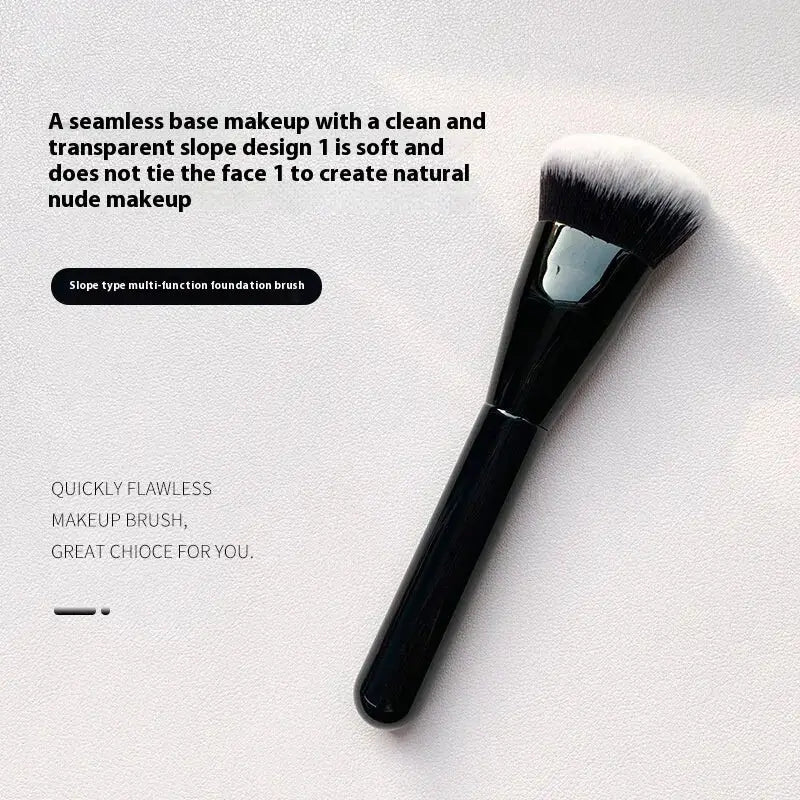 Angled foundation makeup brush with black handle and soft white synthetic bristles for seamless base application