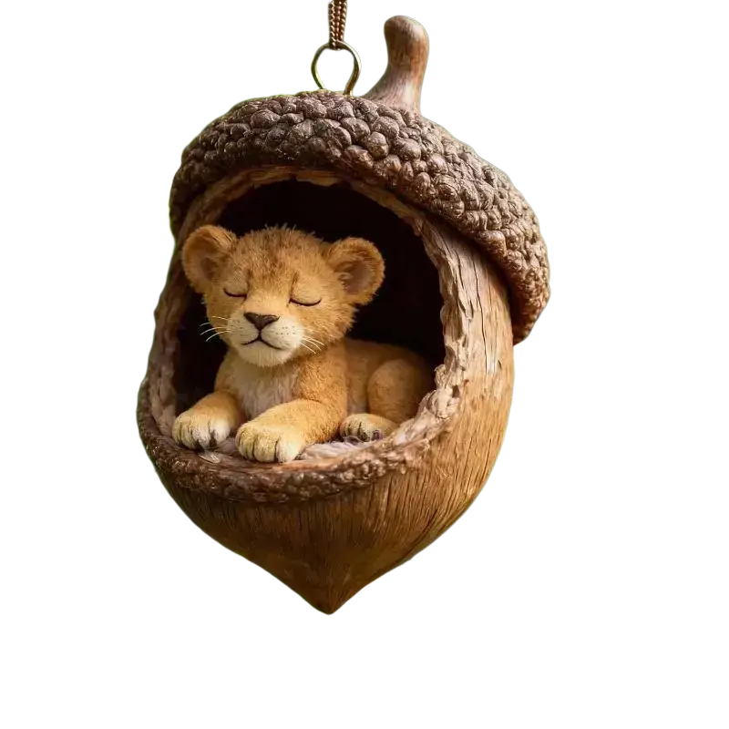 A brown acorn-shaped animal christmas ornament featuring a sleeping lion cub with realistic fur for christmas tree decor