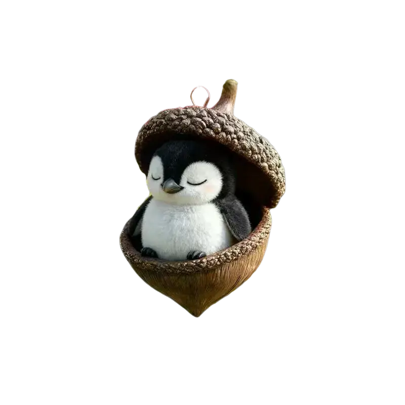 Cute black-and-white plush penguin nestled inside textured acorn-shaped acrylic animal christmas ornament for tree decor