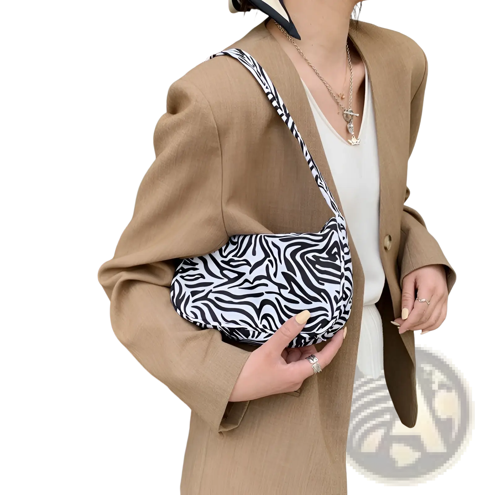 Animal print underarm shoulder bag for women with black and white zebra print and sleek curved crossbody design