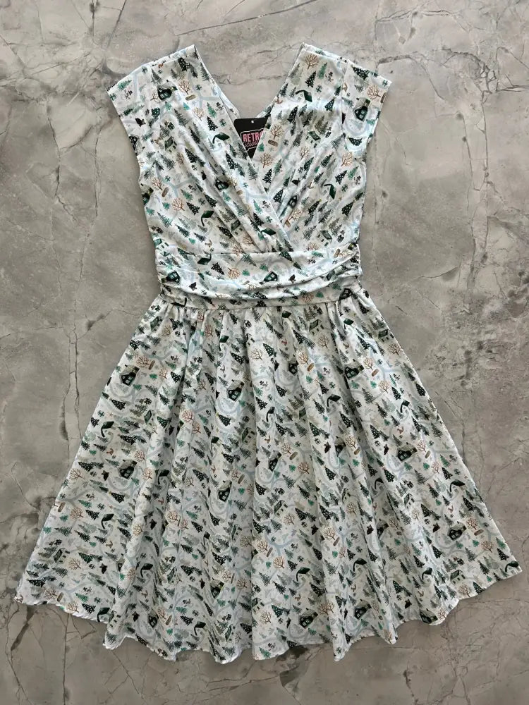 Animal Town Greta v-neck cotton holiday dress in white with black and green festive pattern and short sleeves