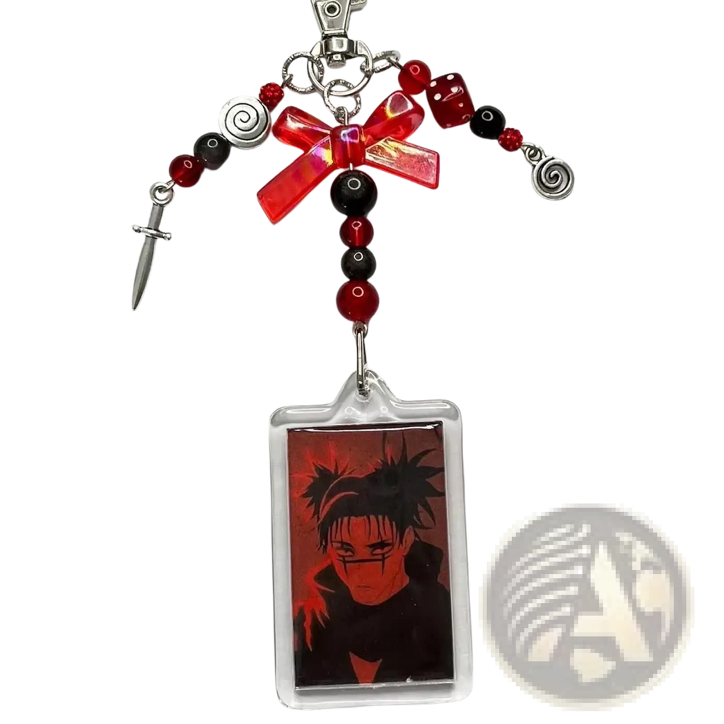 Red and black beaded anime beaded Y2k acrylic keychain with clear charm and silver dice, sword, and spiral charms