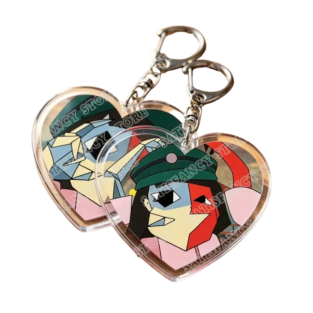 Clear heart-shaped acrylic keychains featuring colorful geometric portraits of characters in green hats and pink outfits