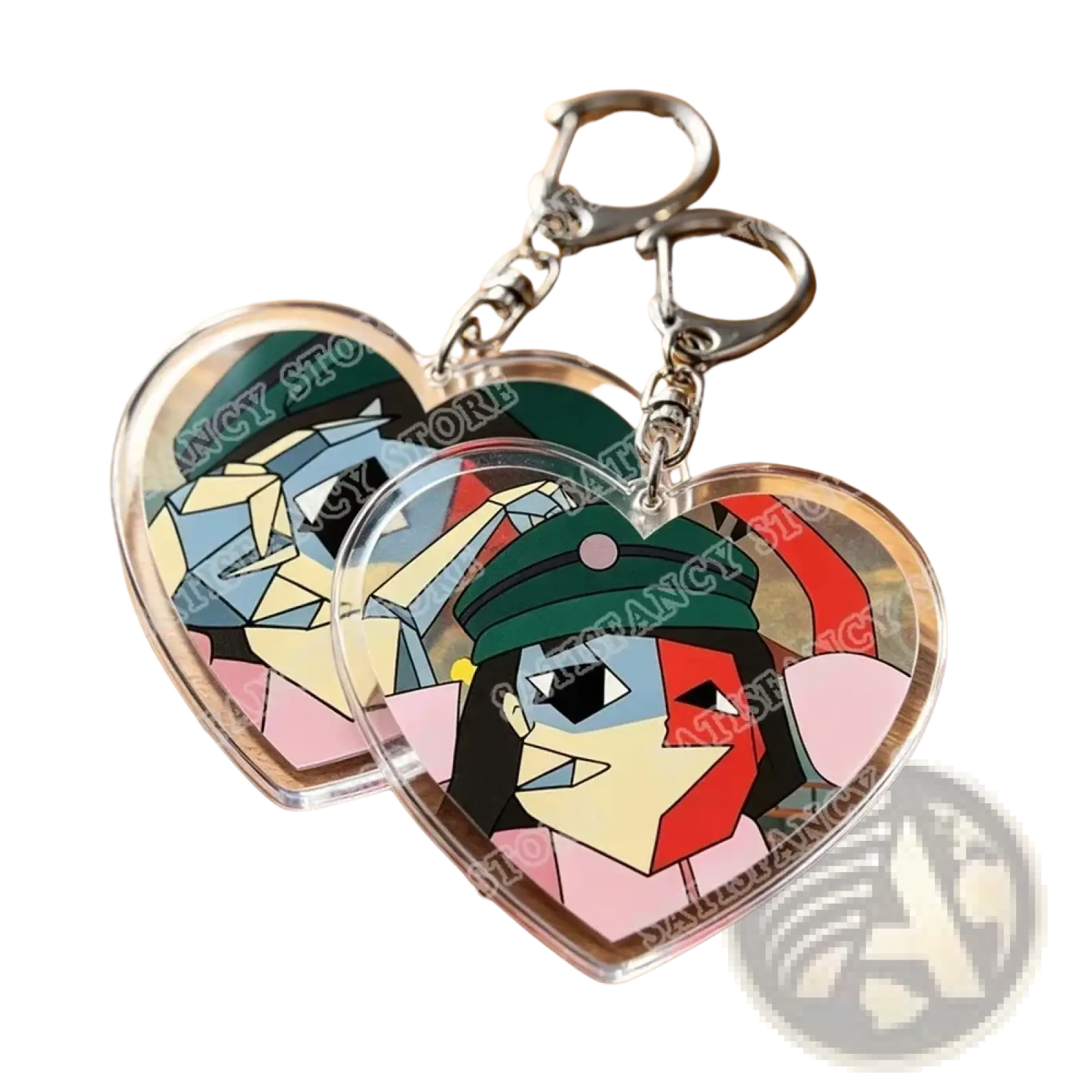 Clear heart-shaped acrylic keychains featuring colorful geometric portraits of characters in green hats and pink outfits