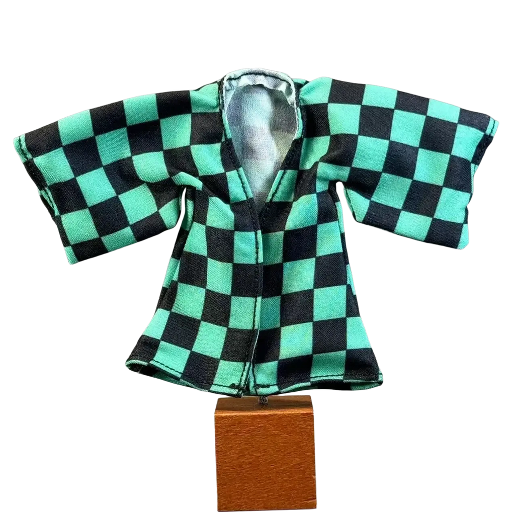 Miniature black and teal checkered anime Kamado Tanjirou kimono coat with silver-lined interior on wooden stand for 6 inch body