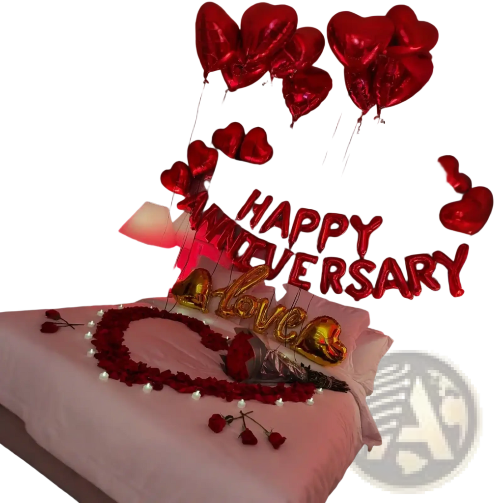 Anniversary decoration set with red and gold heart-shaped balloons spelling happy anniversary and love above rose petals