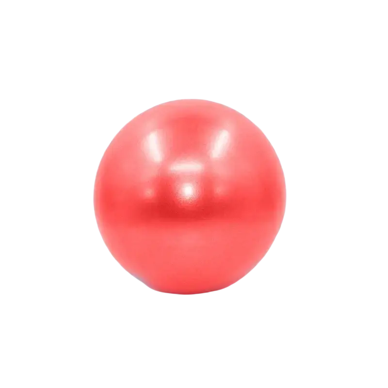 A shiny coral-red anti-burst yoga ball with a smooth surface ideal for balance training and preventing air leakage