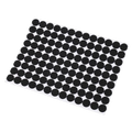 Black circular adhesive anti scratch rubber furniture pads neatly arranged on white backing sheet 5 sheets
