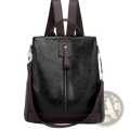 Black leather anti-theft backpack with brown accents and front zipper closure for urban travel use