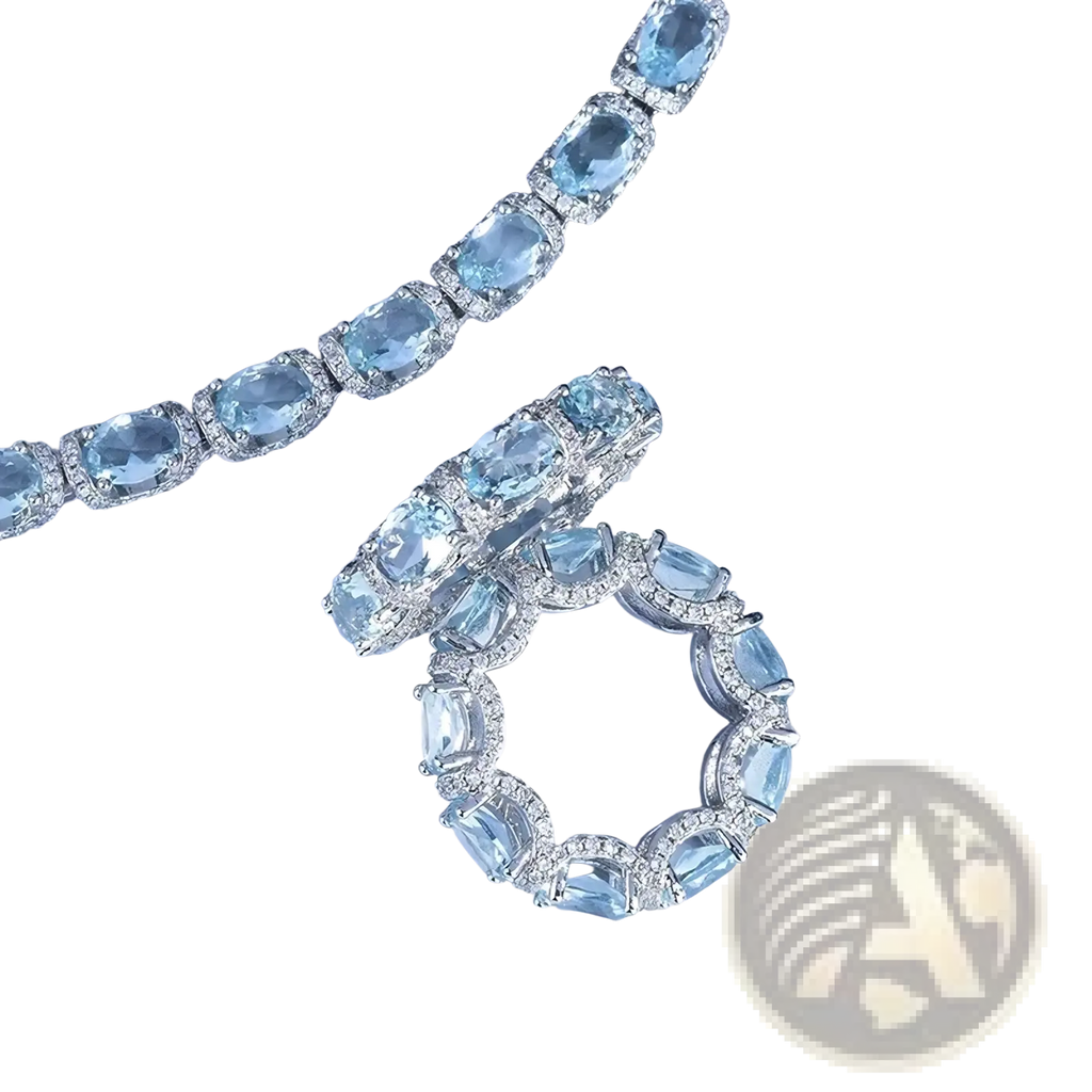 Elegant aquamarine crystal bridal jewelry set with oval-cut stones in silver-toned metal featuring bracelet and ring