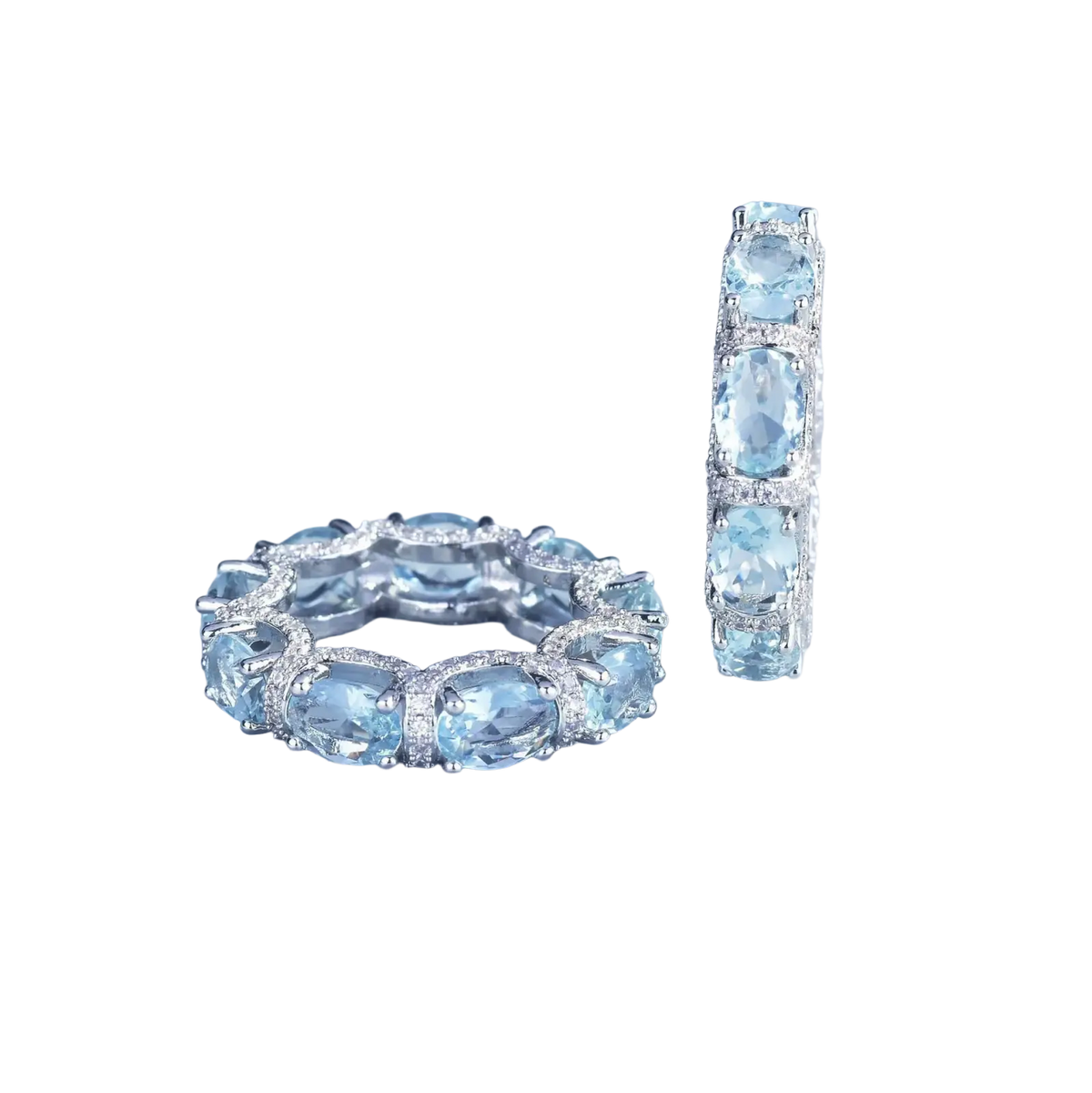 Elegant silver band ring and matching hoop earrings with oval-cut aquamarine crystals and diamond accents bridal set