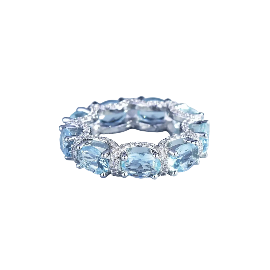 Elegant silver band ring with oval-cut sky blue topaz and sparkling diamonds from aquamarine crystal bridal jewelry set