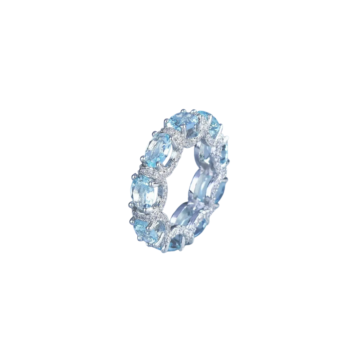 Elegant silver band ring with oval-cut sky blue topaz and pavé diamonds from aquamarine crystal bridal jewelry set