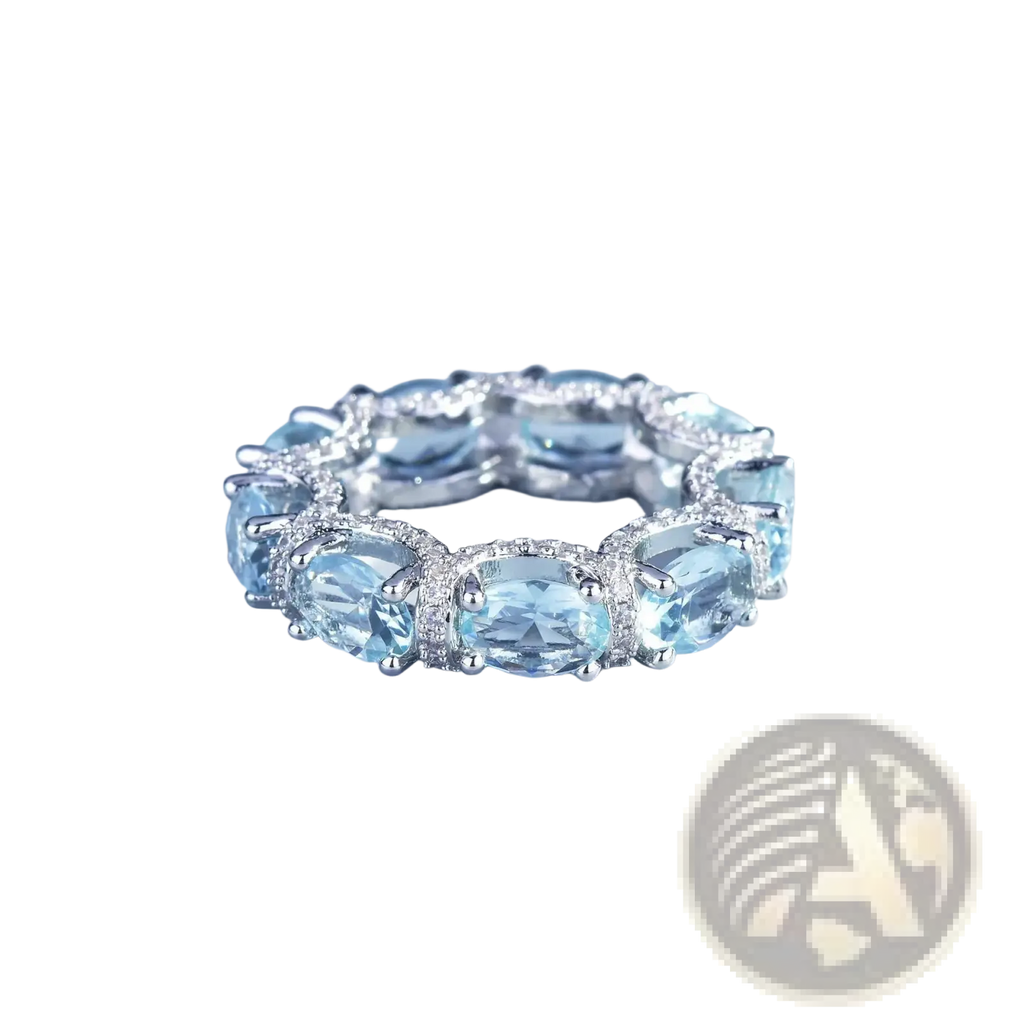Elegant silver band ring with oval-cut sky blue topaz and sparkling diamonds from aquamarine crystal bridal jewelry set