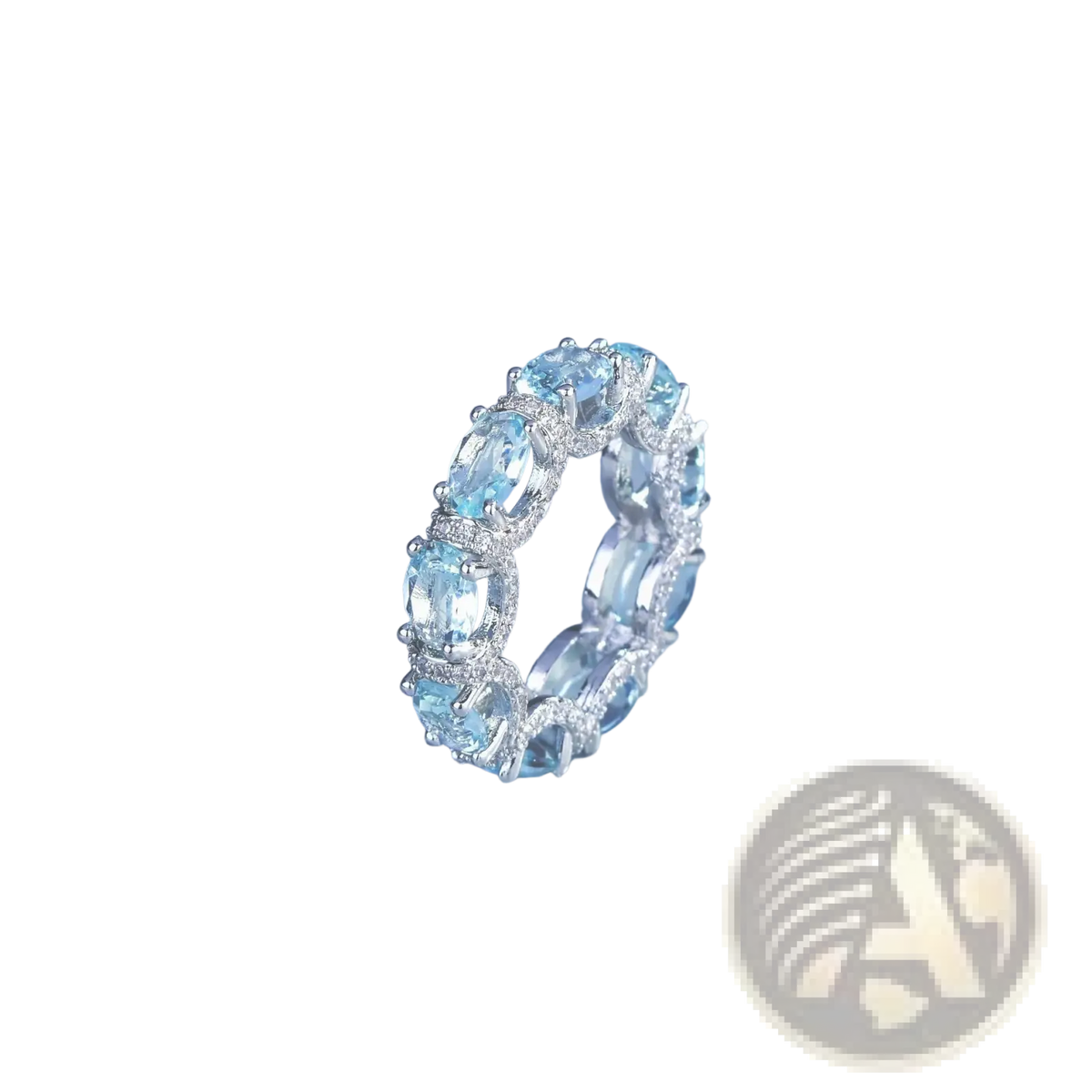 Elegant silver band ring with oval-cut sky blue topaz stones and pavé diamonds in aquamarine crystal bridal set