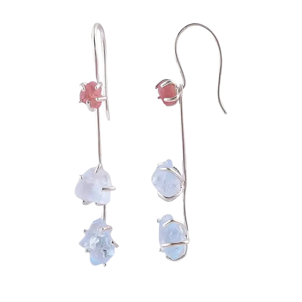 Silver drop earrings featuring a pink spinel gemstone and two light blue raw aquamarine stones below