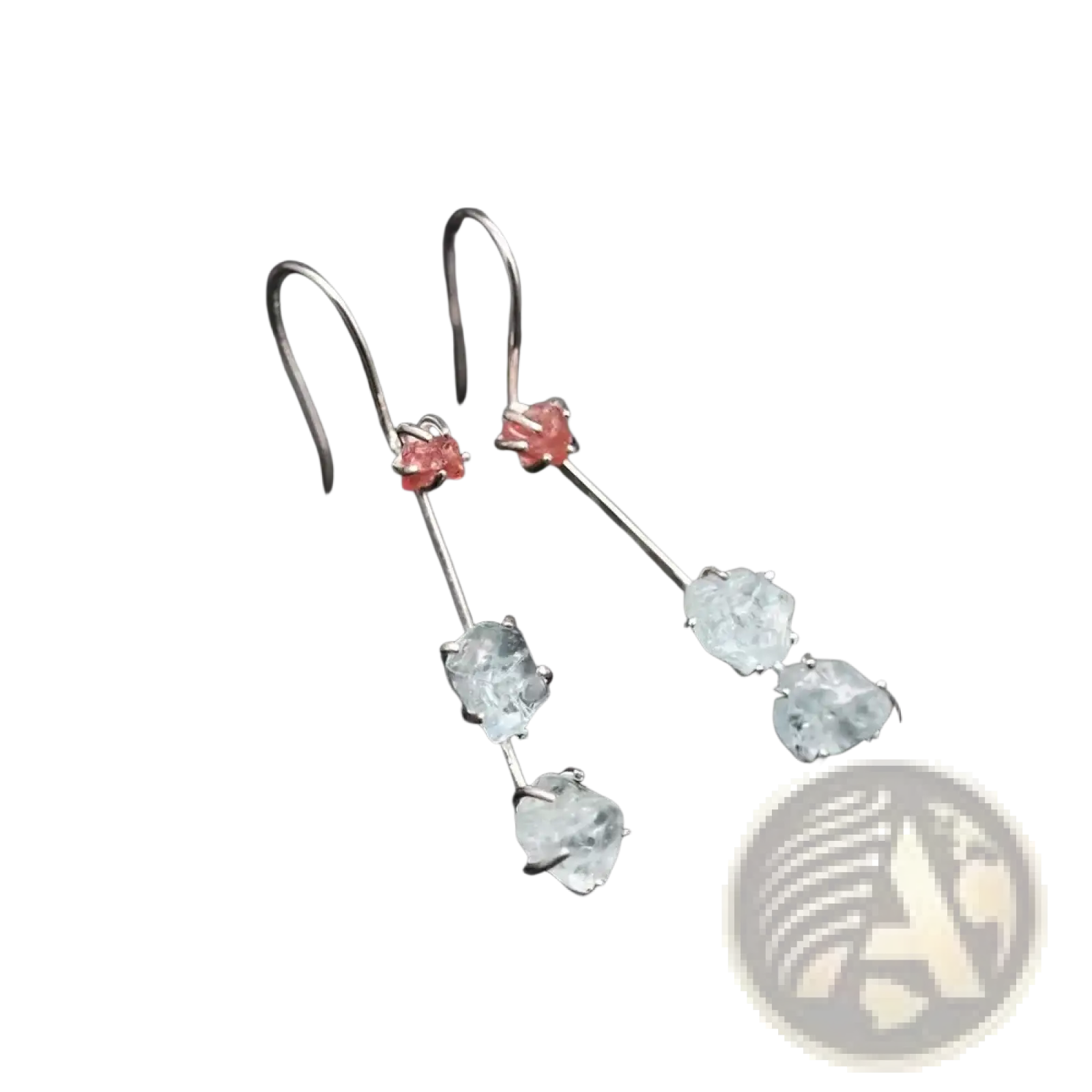 A pair of aquamarine spinel silver drop earrings with silver hooks, pink gemstones, and clear faceted stones below