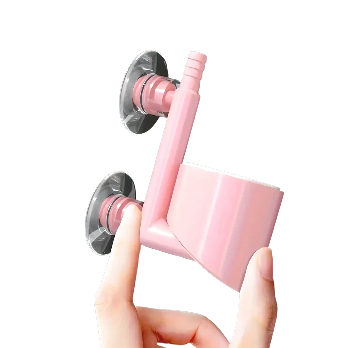 Pink plastic suction-cup-mounted toilet brush holder with curved handle and cylindrical cup for bathroom use