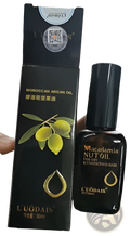 Black glass bottle of l’uodais Moroccan argan oil for dry and damaged hair 50ml for hair care use