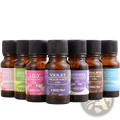 Set of six amber glass aromatherapy essential oil bottles with black caps and colorful fragrance labels for humidifiers
