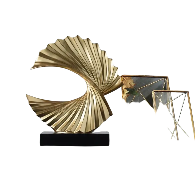 Art deco gold wave sculpture tabletop decor in golden metallic with fan-like spiraling design on black rectangular base