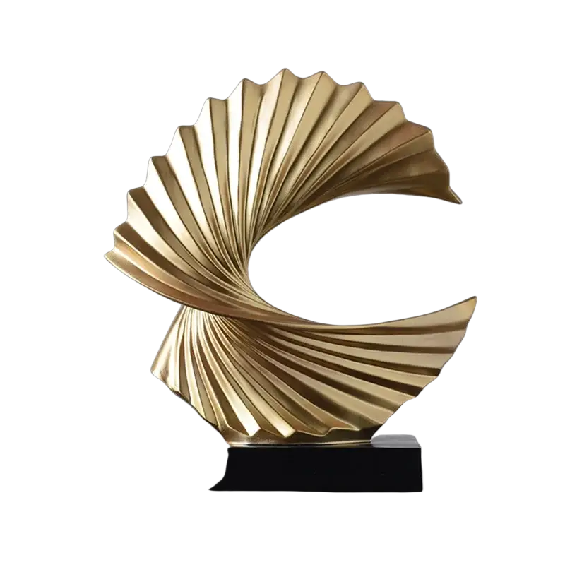 Art deco gold wave sculpture tabletop decor featuring a glossy gold sculpted shell shape with radial ridges