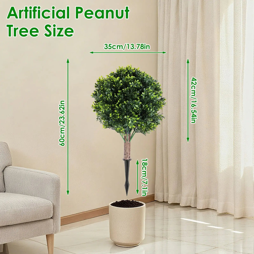 A lush artificial green peanut tree with dense foliage and textured trunk in a beige ceramic pot, boxwood topiary
