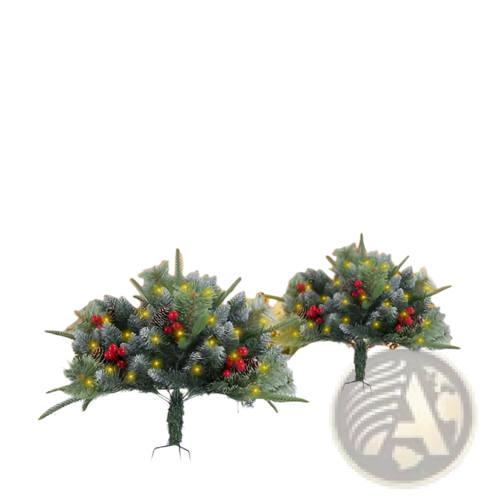 Two artificial Christmas trees with green pine-like foliage red berries and warm yellow LED lights for holiday decor
