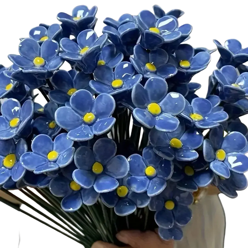 A bouquet of glossy blue ceramic artificial flowers with yellow centers ideal for decorating vases