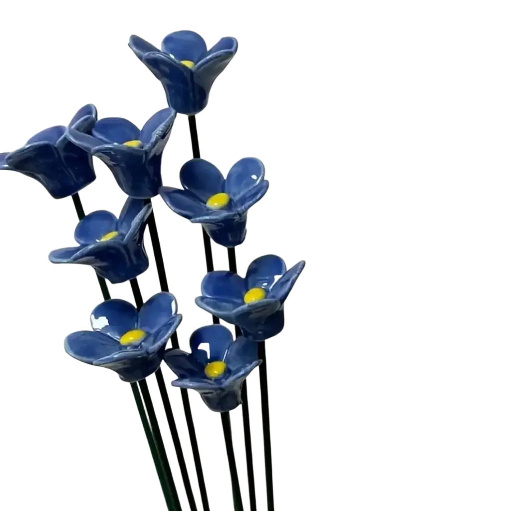 A cluster of artificial flowers blue ceramic forget me nots with bright yellow centers for decorating vases