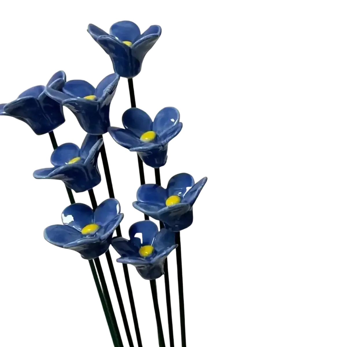 A cluster of artificial flowers blue ceramic forget me nots with bright yellow centers for decorating vases