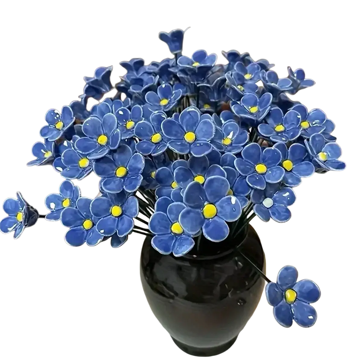A glossy black ceramic vase filled with vibrant blue artificial flowers porcelain forget me nots for decorating vases