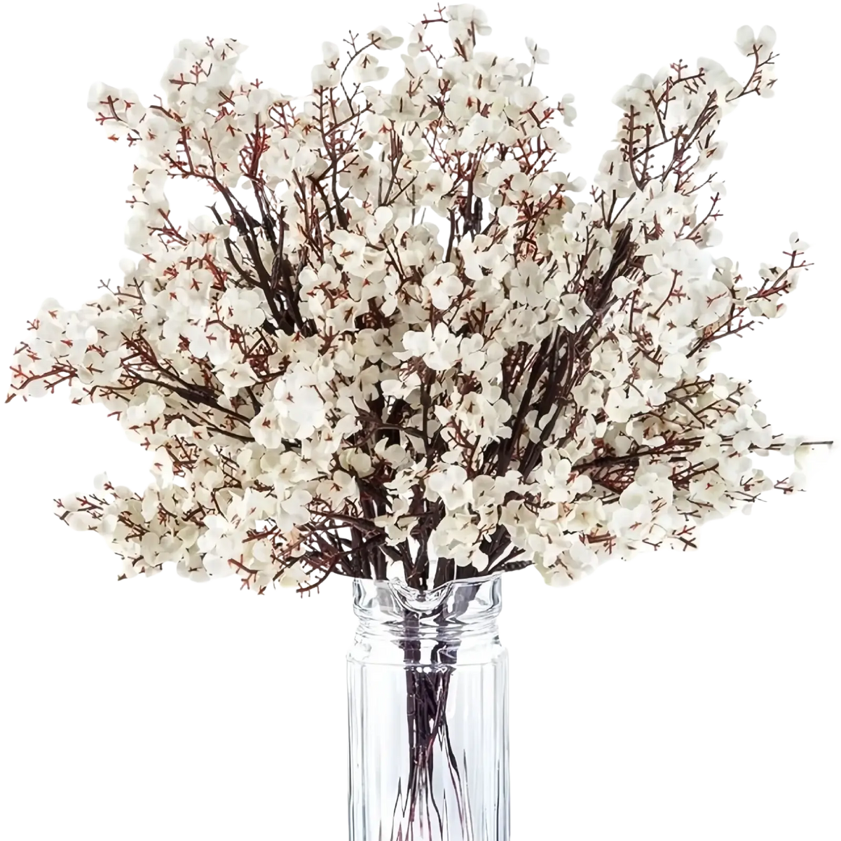 A delicate bouquet of artificial flowers cherry blossoms with white petals and slender brown branches in a clear glass vase