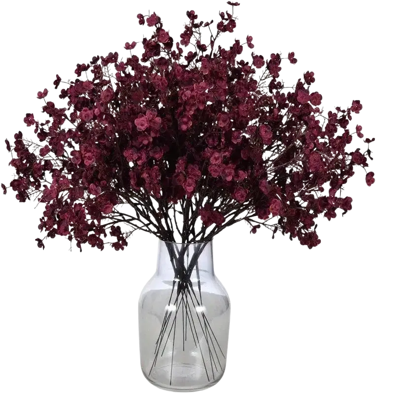 A lush arrangement of deep burgundy artificial flowers cherry baby’s breath in a clear glass vase for decor