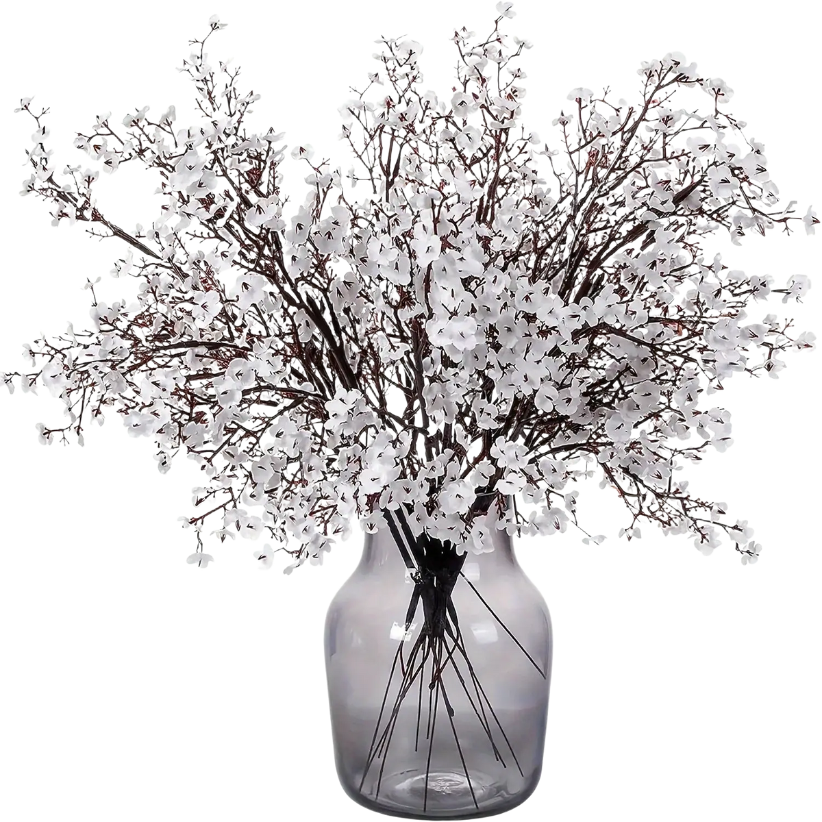 A translucent gray glass vase holds artificial flowers cherry blossoms in white on dark brown branches