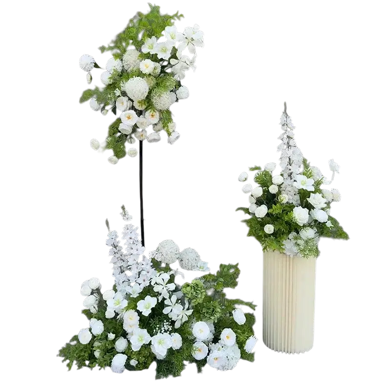 Elegant white and green artificial flowers arranged in a cream-colored ribbed vase for wedding arch backdrop use