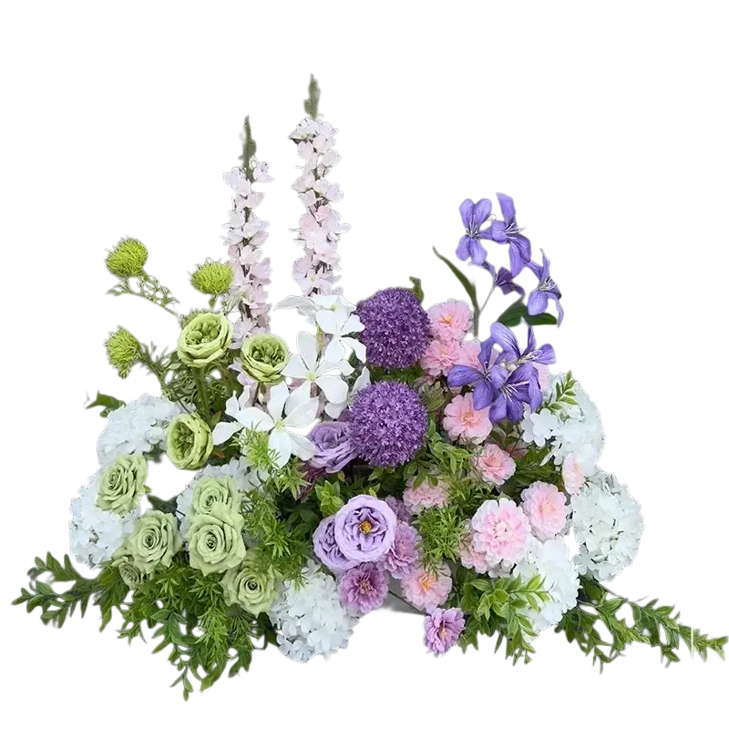 A lush artificial flowers wedding arch floral backdrop with vibrant pink purple white and green blooms and varied textures