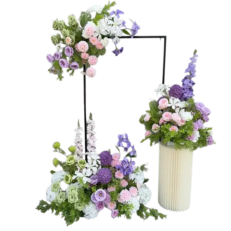 A lush artificial flowers wedding arch floral backdrop with soft pink lavender and white blossoms in cream vase