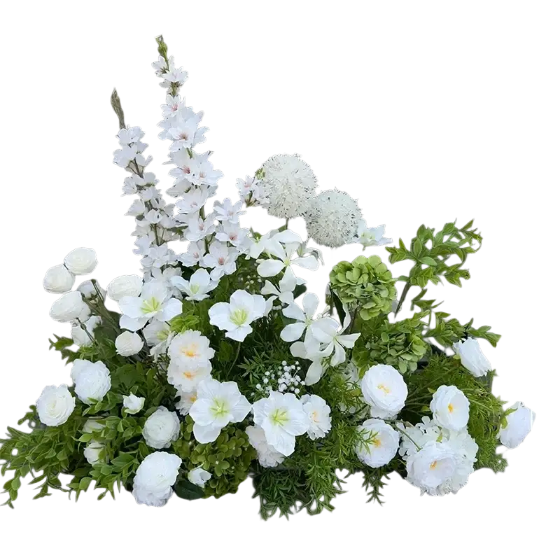 A lush white and green artificial flowers wedding arch floral backdrop with roses hydrangeas and delicate blossoms