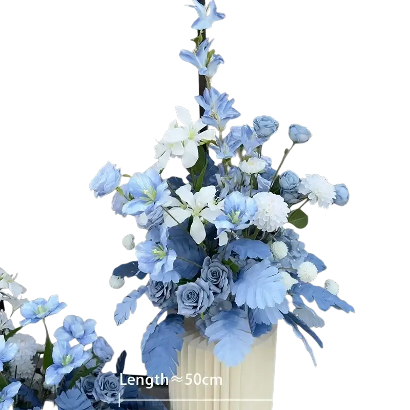 A tall elegant cream vase with blue and white artificial flowers for wedding arch floral backdrop row decoration