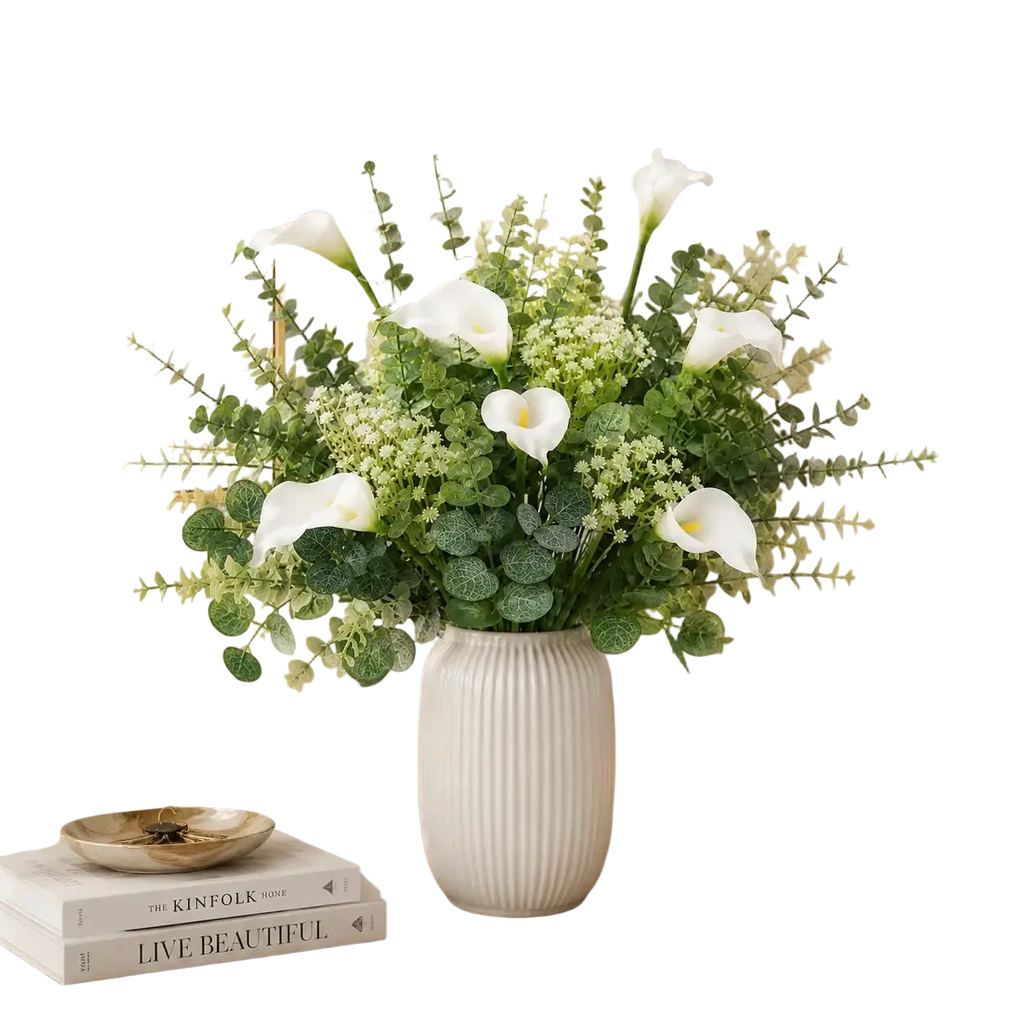 A white ribbed ceramic vase holding artificial mixed flowers 48pcs including calla lilies and eucalyptus leaves