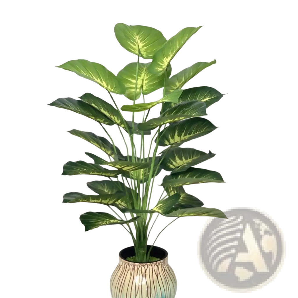 Artificial monstera turtle leaf potted plant with tall lush dieffenbachia leaves and ceramic pot with brown stripes and teal accents