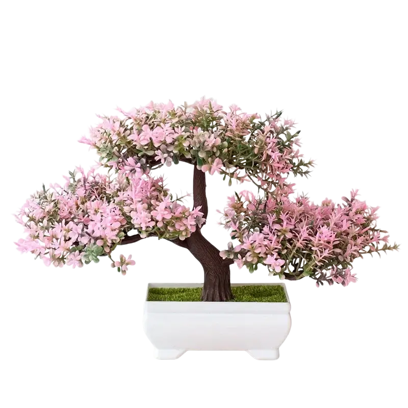 A delicate pink and green artificial plants bonsai with a dark brown trunk in a white ceramic small tree pot with faux moss