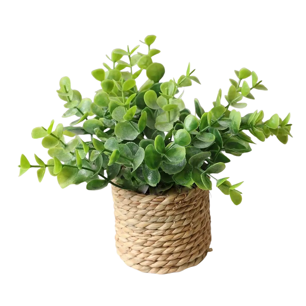 A lush artificial eucalyptus plant with green leaves in a woven natural fiber pot small potted plants decor